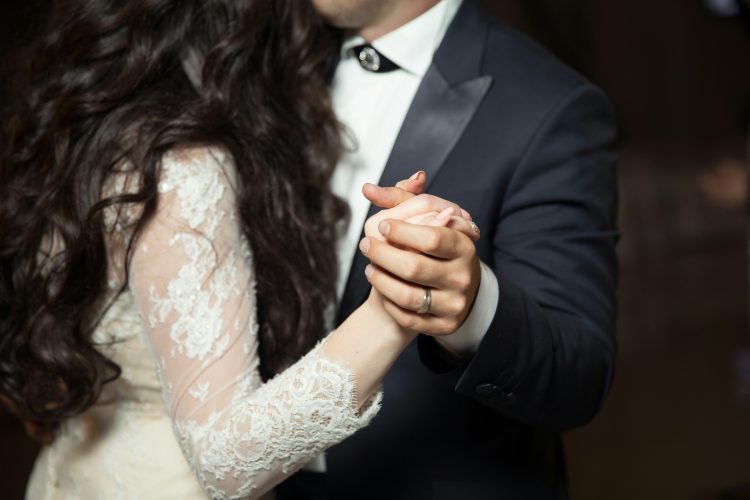 The couple dancing on their wedding day